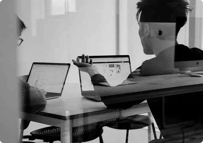 People working together at laptops