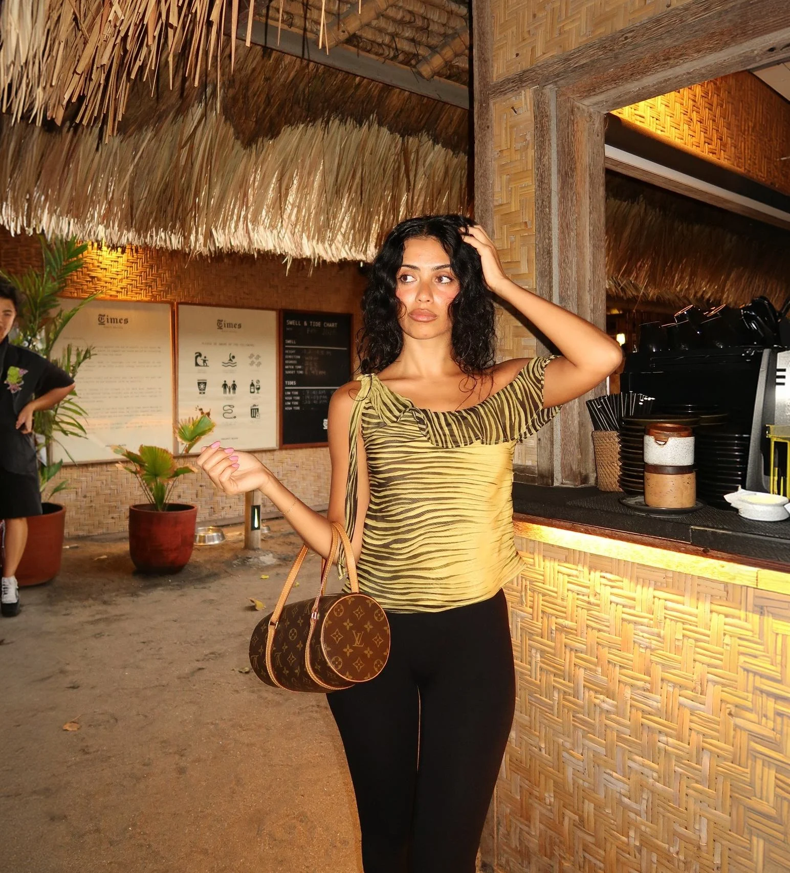 Woman carrying a vintage monogram shoulder bag