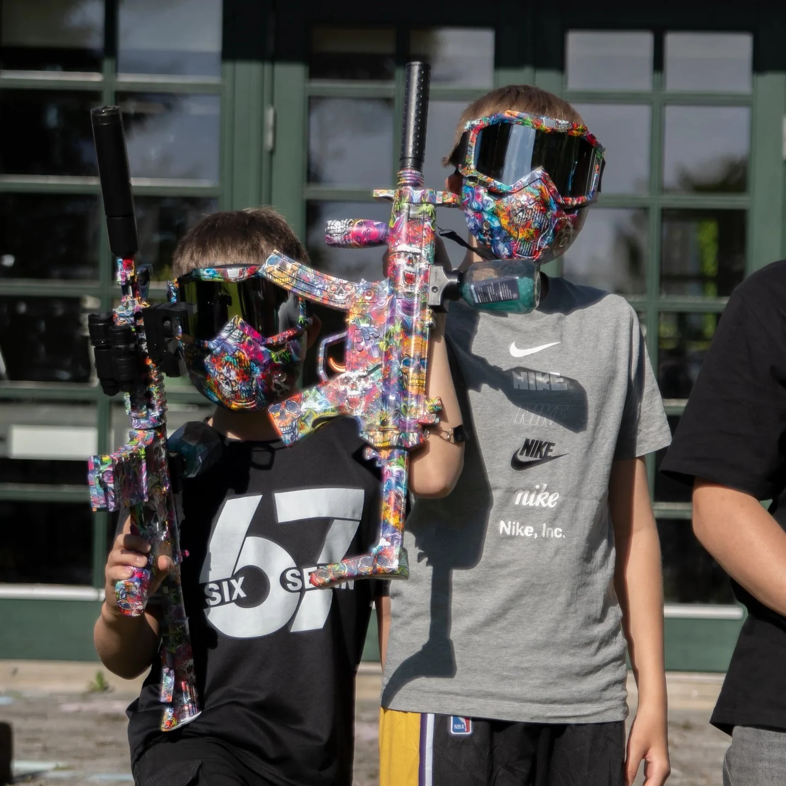 Gel blaster players wearing protective face masks